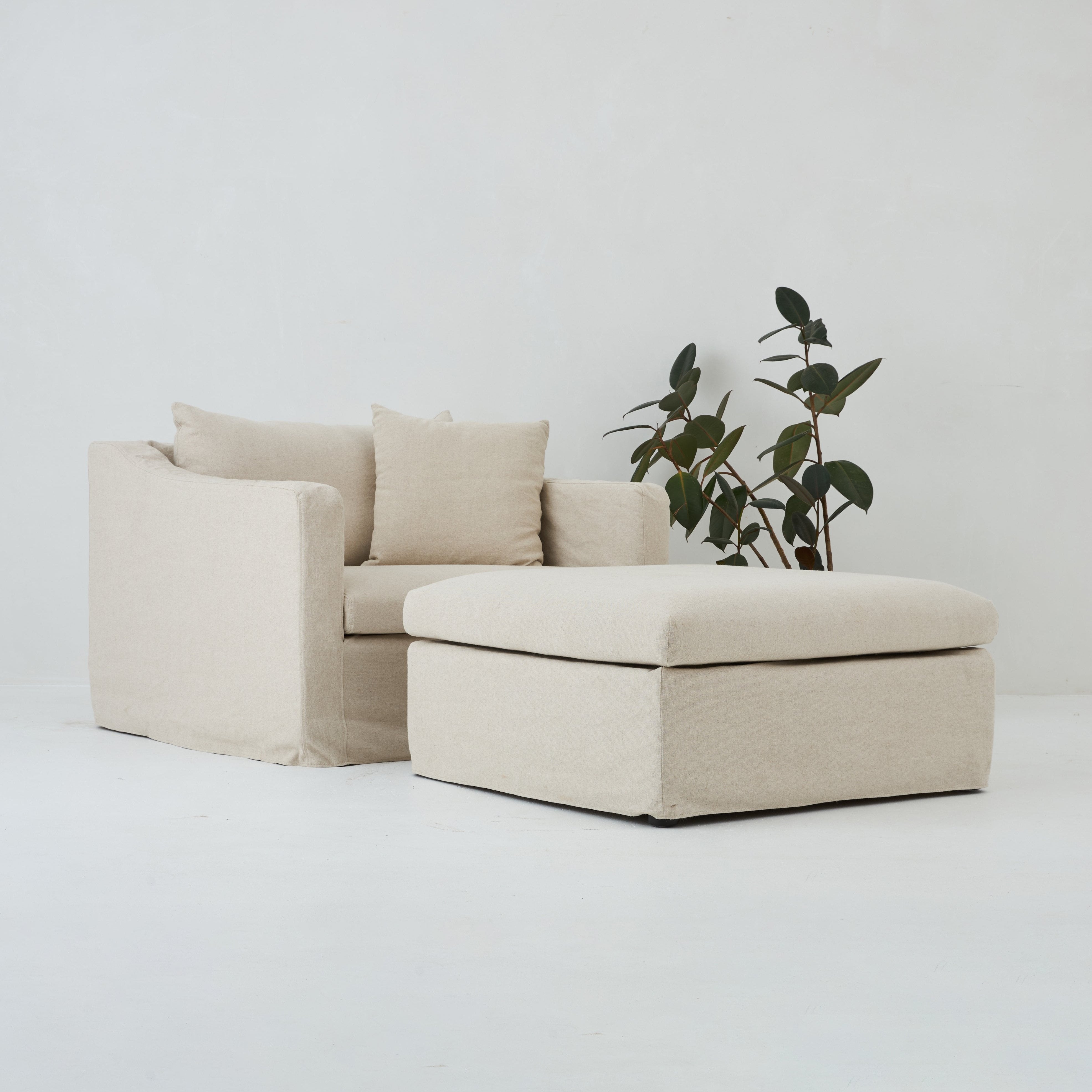 Ayla armchair and ottoman in natural linen by Bodhi Living